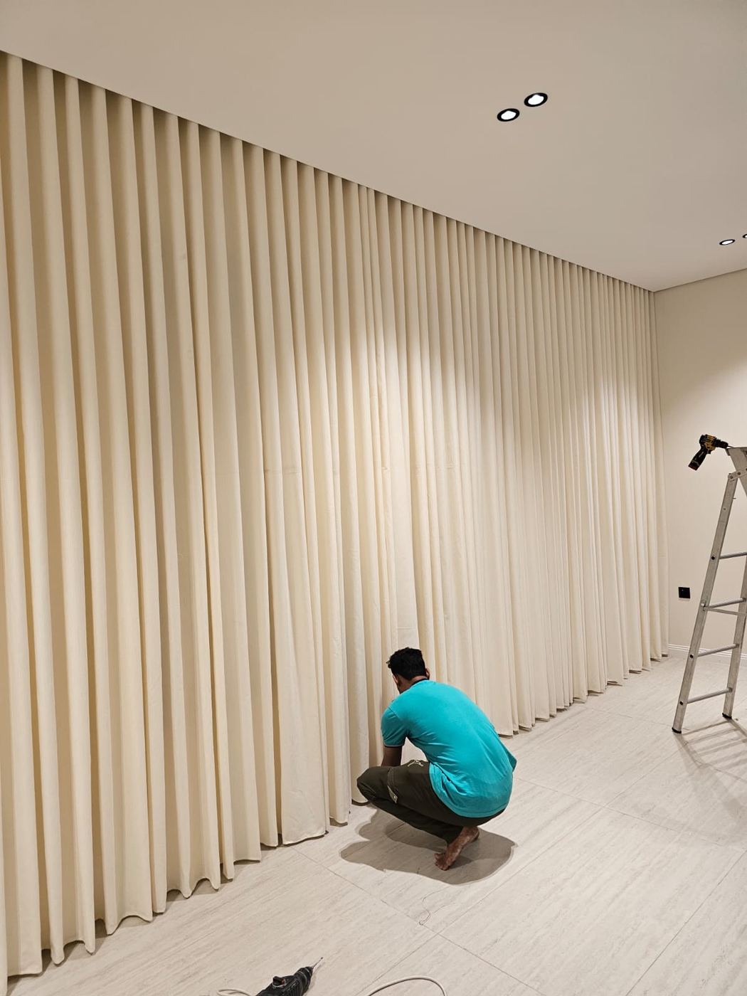 Rafa team installing curtains